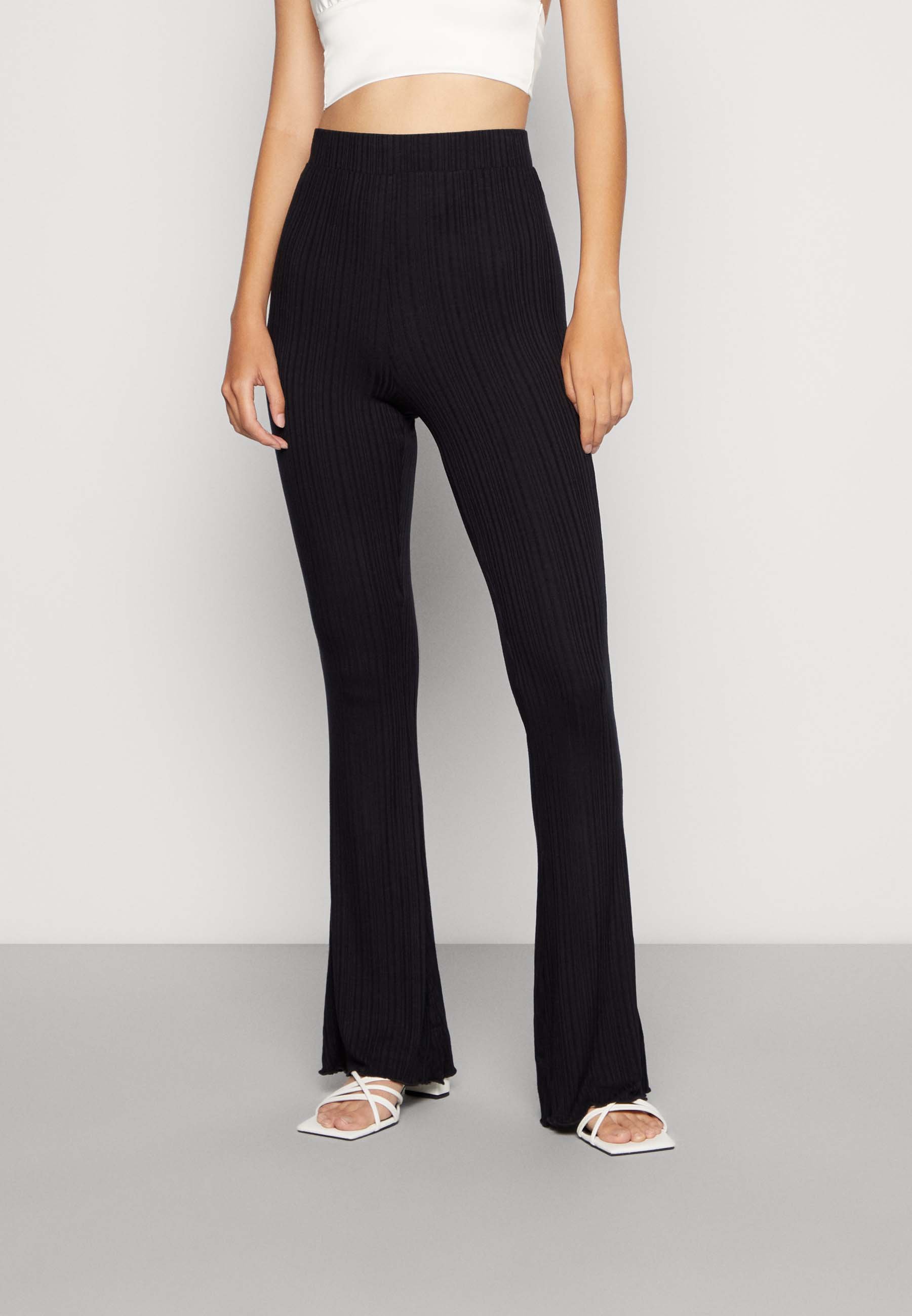 Pieces Petite glitter high waisted flared trousers in black