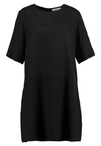 Tunique noire à manches courtes en tissu lisse, dotée d'un col rond, d'une couture au niveau de la taille et d'une fermeture éclair dissimulée au dos.