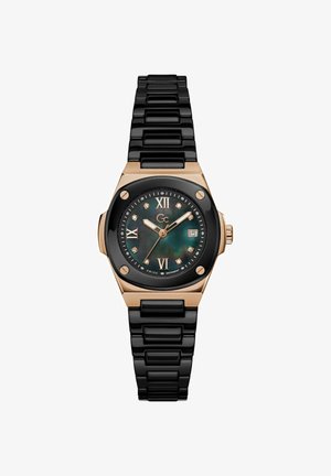 Czarny ceramiczny zegarek na rękę w złotym kolorze z tarczą z masy perłowej, rzymskimi cyframi, znacznikami godzin z diamentów, oknem daty i połączonym bransoletą.