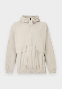 Ανοιχτό μπεζ πουλόβερ μπουφάν με κουκούλα, μπροστινό φερμουάρ έως τη μέση, ελαστικά μανίκια και ρυθμιζόμενο κορδόνι στη μέση. Διαθέτει μπροστινή τσέπη και λεία υφή.