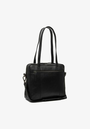 Sac fourre-tout en cuir noir avec double poignées, fermeture zippée et poche extérieure, présentant une texture lisse et un design minimaliste.