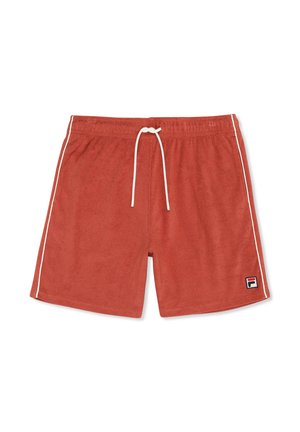 Pantaloncini in spugna color ruggine con coulisse bianca, piping laterale bianco e una piccola toppa con il logo Fila sulla gamba sinistra.