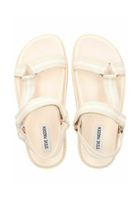 Sandali beige con cinturini texturizzati, suola piatta e design minimalista. Presentano cinturini regolabili e un logo sulla soletta.
