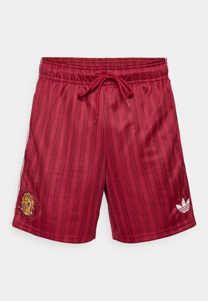 Røde shorts med striber lavet af letvævet stof, med elastisk talje og snøre samt en broderet logo på venstre ben.