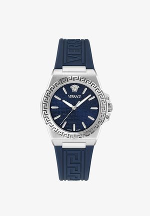 Versace kell, millel on roostevabast terasest korpus, tumesinine tekstureeritud kelladial, hõbedased tundemarkeri ning sinine kummist rihm, millel on kreeka võtmustr.