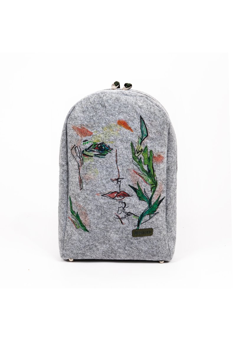 Gray felt backpack with an abstract face design and colorful accents. Features a rounded top and metal zippers for closure.