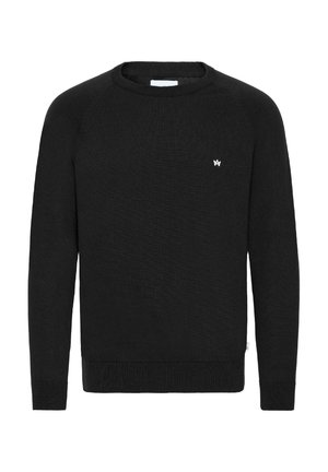 Black sweater made of textured knit fabric, featuring a crew neck and ribbed cuffs, with a small white logo on the chest.