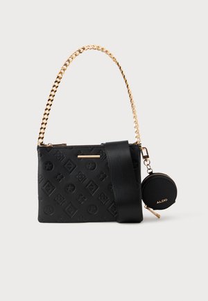 Black handbag with embossed pattern, metallic chain strap, and a detachable round coin pouch. Smooth texture and gold accents.
