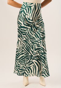 GINI LONDON ZEBRA BIAS - Maxi skirt - green
