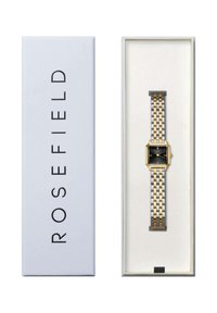 Orologio in acciaio inossidabile dorato e argentato con quadrante quadrato nero, racchiuso in una scatola bianca contrassegnata "ROSEFIELD". Presenta un bracciale a maglie e un quadrante semplice.