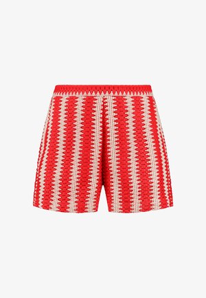 Red shorts featuring a textured fabric with white vertical stripes and a scalloped pattern. Elastic waistband and loose fit design.