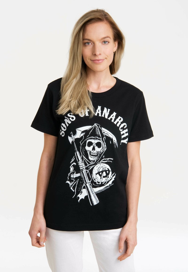 Black cotton t-shirt featuring a graphic of a skull in a hooded cloak, holding a weapon, with the text "Sons of Anarchy" in white above.