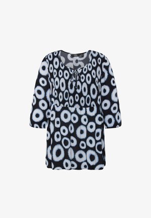 Zwarte tuniek met een ronde halslijn, driekwart mouwen en een algeheel cirkelpatroon in wit en lichtblauw. Decoratieve strik bij de hals.