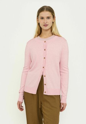 Light pink cardigan with a round neckline, long sleeves, and gold-tone button closures. Features ribbed hem and cuffs. Paired with brown trousers.