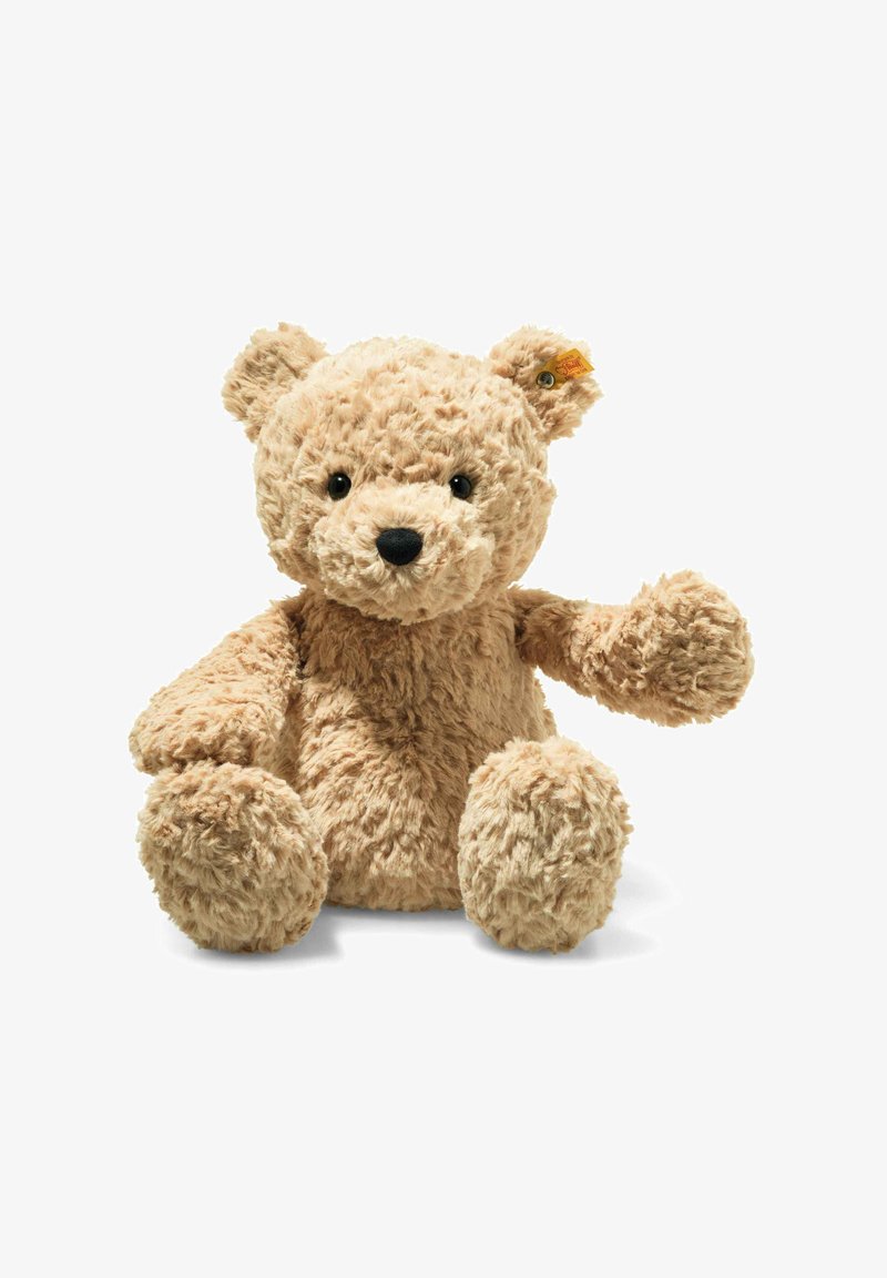 Plüsch-Teddybär mit einer weichen, flauschigen Textur, hellbeiger Farbe, runden Ohren und schwarzen Knopfaugen. Auf dem Ohr befindet sich ein kleines Markenetikett.