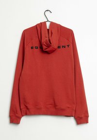 Red hoodie with a drawstring hood, ribbed cuffs, and hem. Features a printed logo "EQUIPMENT" in black across the back, smooth fabric texture.