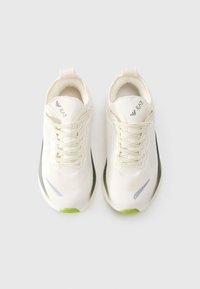 Pair of white sneakers with light green accents, mesh uppers, and lace-up design, viewed from above on a plain background.
