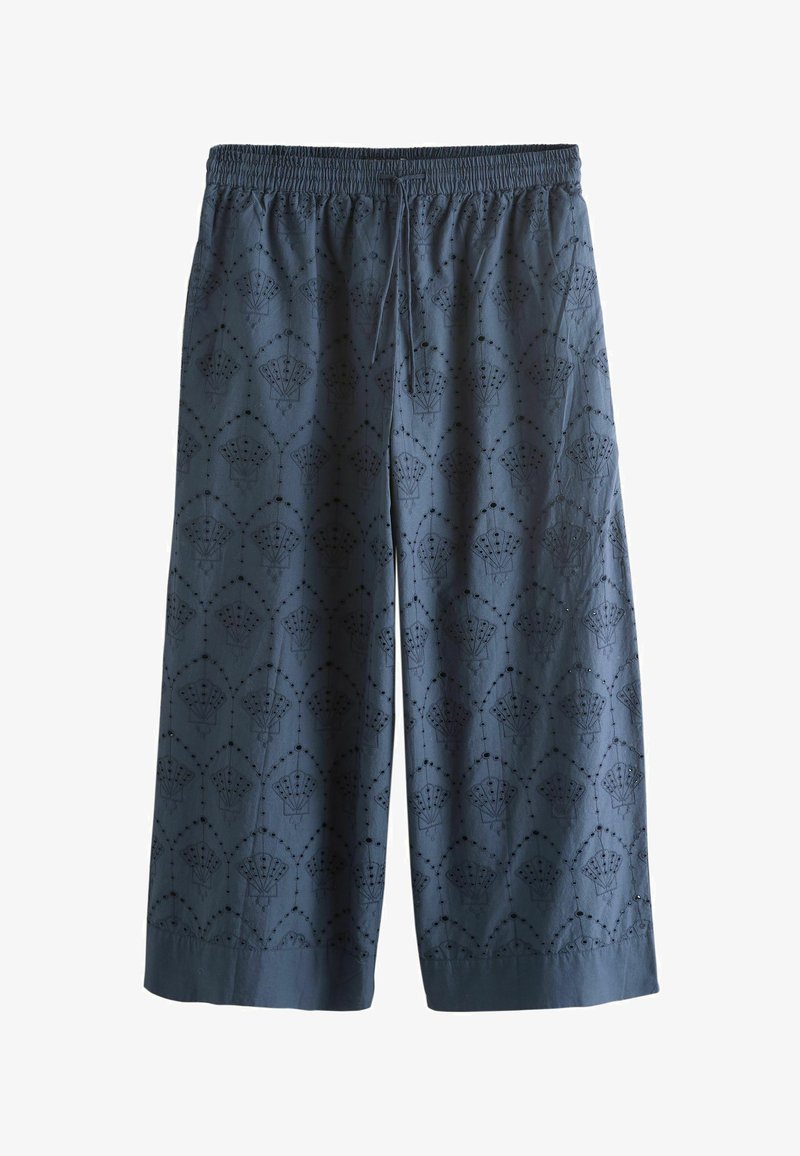 Pantalon bleu à jambes larges avec taille élastique et cordon de serrage, présentant un motif de découpe en éventail et points brodés sur toute la surface.