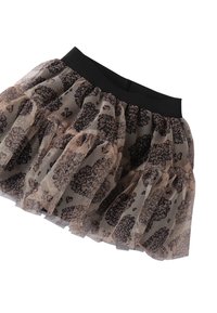 Falda de tul con volantes en capas, con un patrón de estampado de leopardo en negro y beige. Cinturilla elástica para un ajuste ajustable.