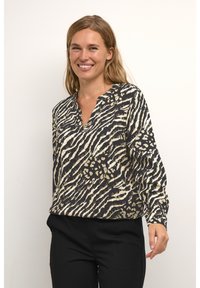 Damesblouse in zwart met een gouden en crèmekleurig dierenprint. Heeft een V-hals, lange mouwen en een relaxte pasvorm. Soepele stoftextuur.