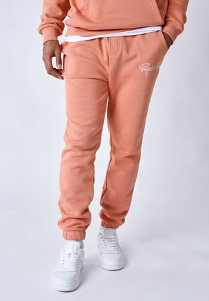 Tracksuit bottoms - orange cuivre