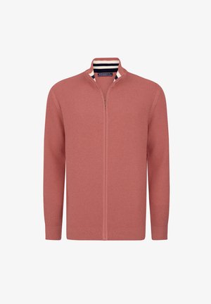 Zip-up sweater in dusty pink, ribbed texture, featuring a stand collar with navy and cream striped accents. Long sleeves and fitted design.
