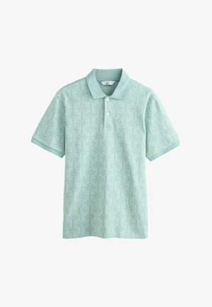Světle zelené polo tričko s krátkými rukávy s jemným vzorem palem a dvěma knoflíky na předním klínu.