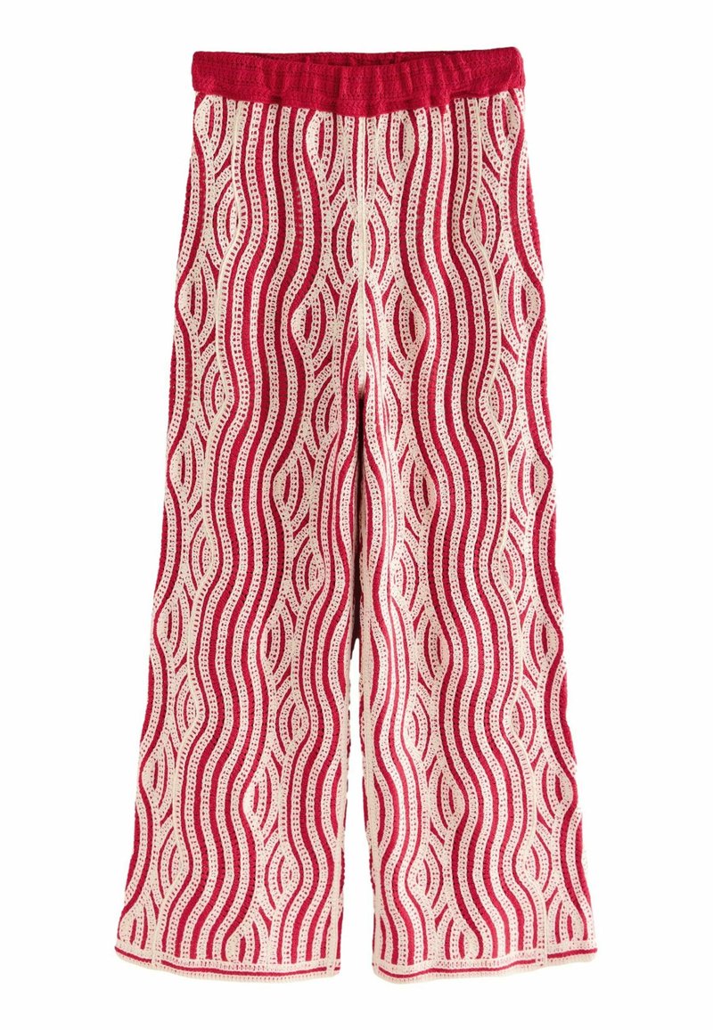 Pantalon large rouge et crème avec un motif en vagues et une taille élastique. Fabriqué à partir d'un tissu doux avec une finition texturée.