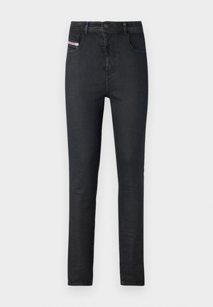 Svarte denimjeans med smal passform. Egenskaper inkluderer fem lommer, glidelås foran og en subtil logoetikett på framlommen.