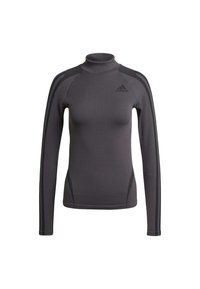 Sivý dlhý rukáv s vysokým golierom, vyrobený z textúrovanej látky s čiernymi pruhmi na ramenách a logom Adidas na hrudi.