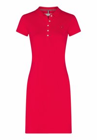 Rode polojurk met korte mouwen, twee-knop sluting, rechte zoom en subtiele logoaccent op de borst. Gemaakt van zachte katoenen stof.
