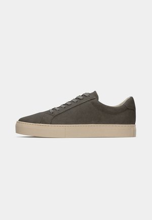 Gray suede sneaker with a textured surface, round toe, and beige rubber sole; features flat laces and minimalistic design.