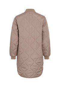 Μακρύ μπεζ μπουφάν με ραφές σε κυματιστό μοτίβο, ριμπ μανσέτες και στρογγυλεμένη κάτω πλευρά, εμφανιζόμενο από πίσω σε λευκό φόντο.