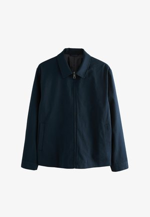 Veste bleu marine en tissu texturé, avec un col, une fermeture éclair sur le devant et deux poches latérales.