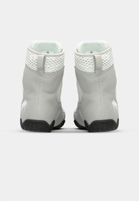 Gray ankle boots with a smooth matte texture and mesh accents, featuring a black rubber sole and a white logo near the heel.