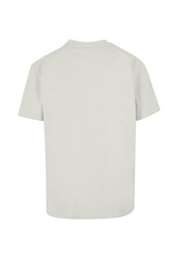 Kortærmet t-shirt i lys grå bomuld med rund halsudskæring og en afslappet pasform. Ingen grafik eller mønstre; enkelt design.