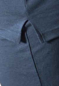 Dark blue fabric with a soft texture, featuring a split detail at the waist and a smooth finish along the seams.