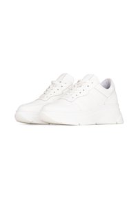 White leather sneakers with a textured finish, featuring a thick sole and lace-up design, accented by tonal stitching and minimal branding.