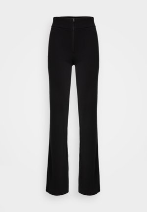 Černé široké kalhoty s vysokým pasem a předním zipem. Vyrobeno z hladké, elastické tkaniny pro pohodlí a volnost pohybu.