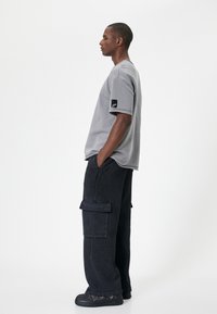 Koton OVERSIZE - Cargobukser - black