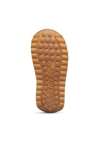 Semelle en caoutchouc avec texture circulaire, dotée d'un design strié. Le dessous affiche le logo "N" et la taille "21" intégrés dans le matériau.