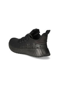 Black athletic shoes with a textured knit upper, thick ridged sole, and elastic laces. Features prominent branding in matte black on the side.