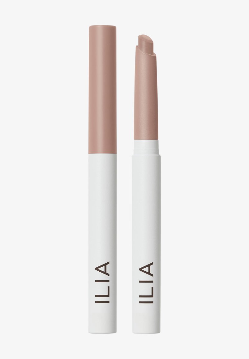 Two ILIA lip crayons, one closed and one open showing the mauve-pink product, both in white tubes with beige tops, upright on a white background.
