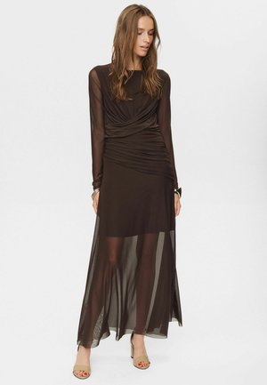 Black, long-sleeve dress with draped bodice and sheer skirt. Smooth fabric with subtle texture, mid-calf length, and fitted at the waist.