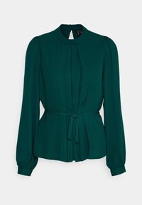 Blusa verde a manica lunga con pieghe, colletto alto e cintura legata. Realizzata in tessuto liscio con maniche arricciate e dettaglio a oblò sulla schiena.