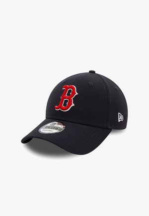 Navy baseball cap with red embroidered "B" logo. Features six panels, curved visor, and adjustable strap. Soft fabric texture.