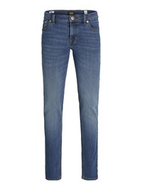 Uske traperice plave boje od trapera, s pet džepova, prednjim patentnim zatvaračem i narančastim naglascima šavova.