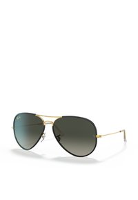 Occhiali da sole aviator con montatura in metallo dorato, dettagli neri e lenti grigie sfumate. Presentano un doppio ponte e naselli trasparenti.