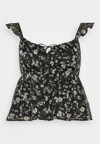 Svart blommig topp med en samlad byst, volangaxlar och en knytning framtill. Designen inkluderar små vita och gröna blommönster.