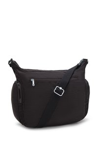 Black fabric shoulder bag with multiple zippered pockets, adjustable strap, and smooth texture. Rounded shape with a soft silhouette.